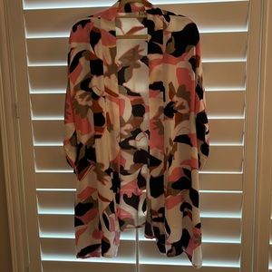 Loose fitting multicolor jacket. Great over top.